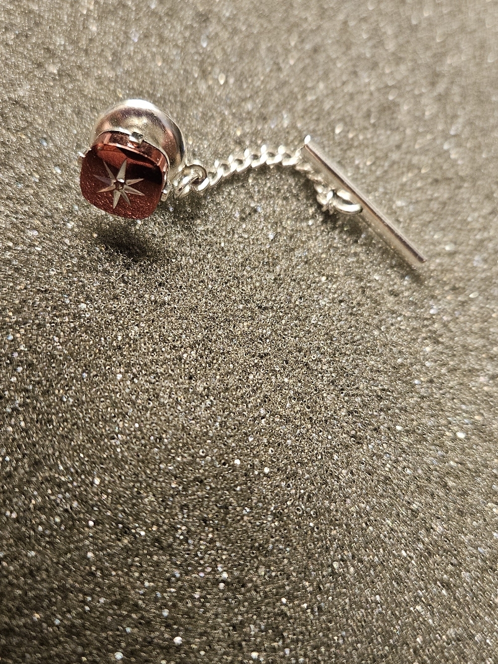 Silver Tie Pin with Red Star Accent.